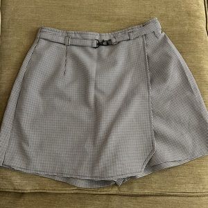 Black and white checkered skort with fun belt on the front